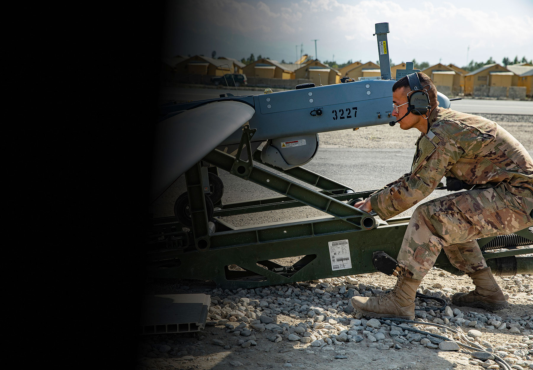 Soldier preparing unmanned aircraft for flight