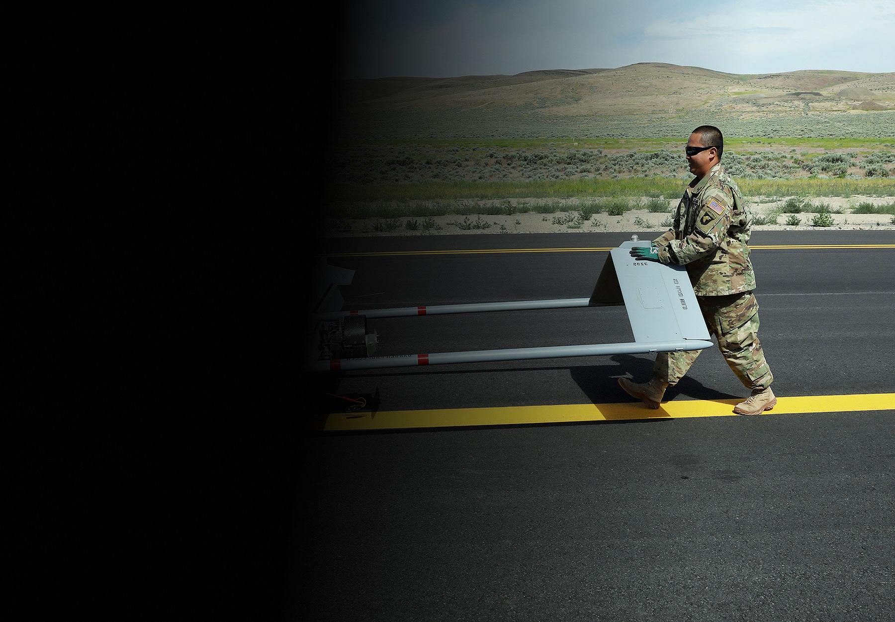 SGT Guevara pushing UAV down runway